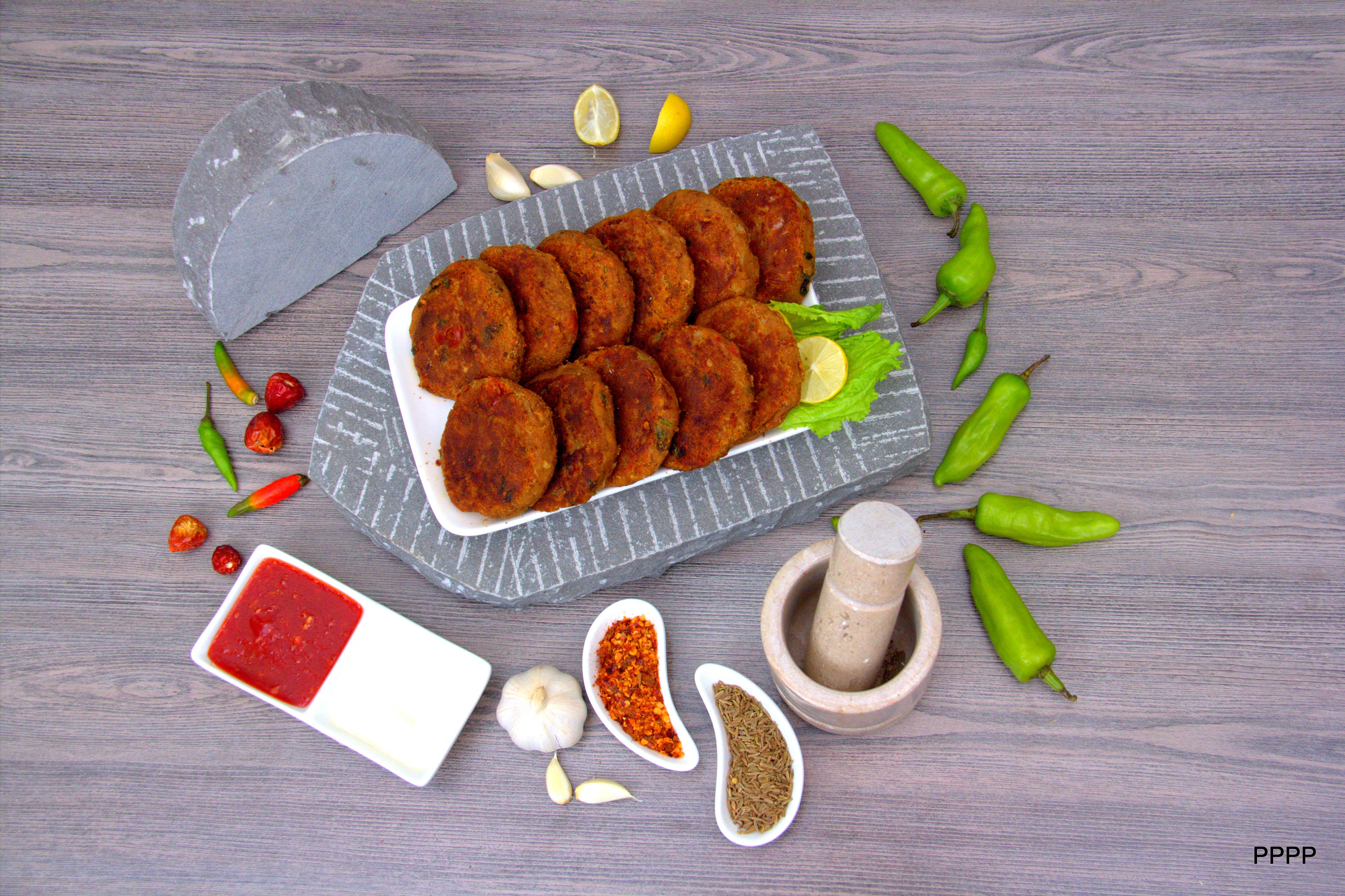 "Delicious Shami Kebabs made with traditional spices and authentic stone grinding methods, offering an unbeatable and flavorful taste."